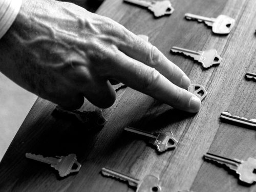 Real-Estate-Hand-Picking-Up-A-House-Key-In-Black-A-2022-11-14-06-53-44-Utc